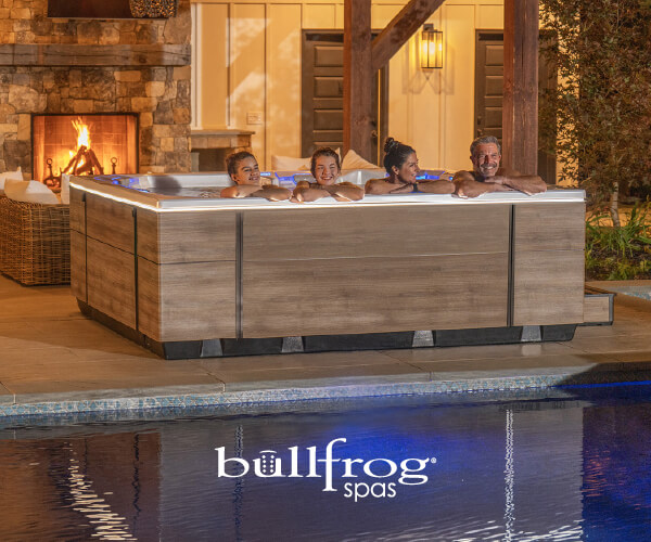 2 people relaxing in a Bullfrog Hot Tub